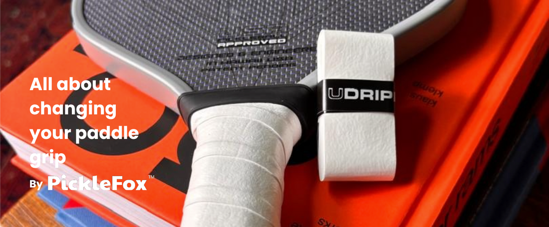 Pickleball paddle grip displayed on a pile of books, highlighting the importance of changing grips for better performance.