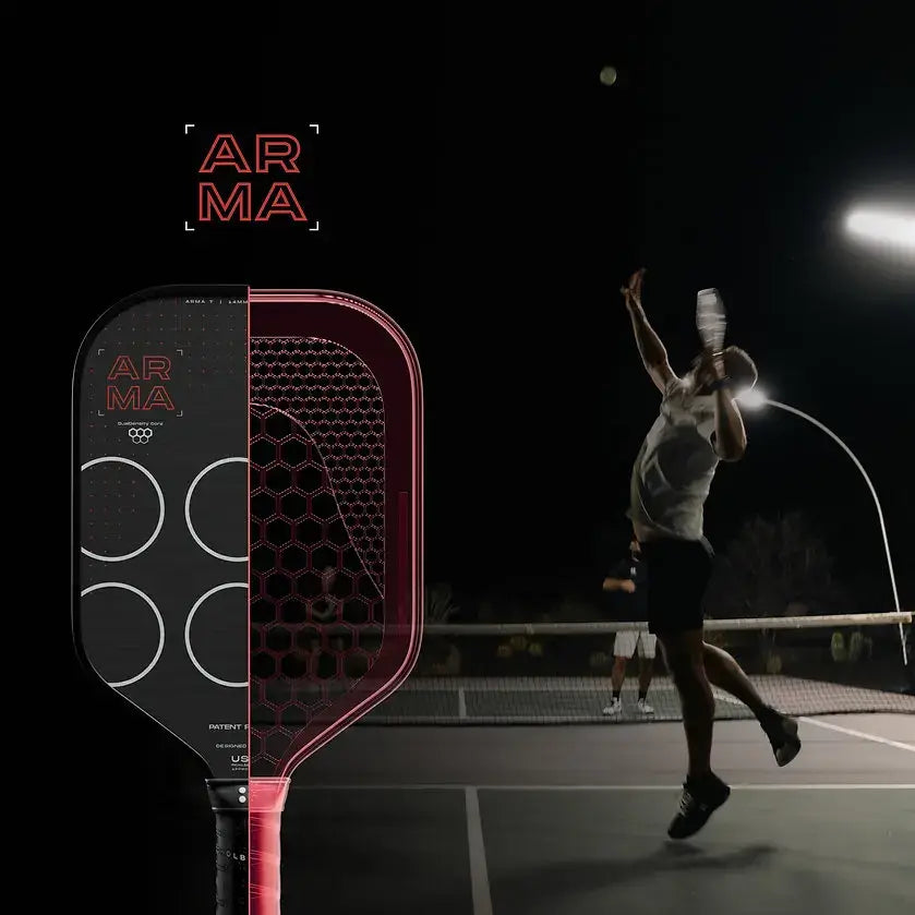 ARMA paddle in focus with player serving at night on tennis court, highlighted by dynamic lighting.