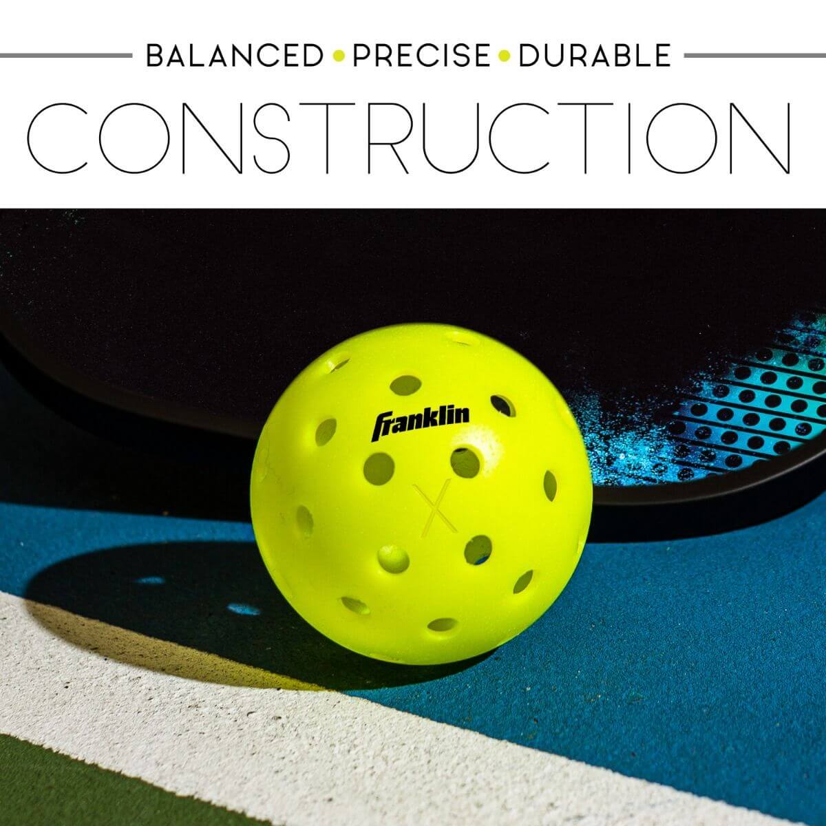 Franklin X-40 outdoor pickleball showcasing balanced, precise, and durable construction on a colorful court.