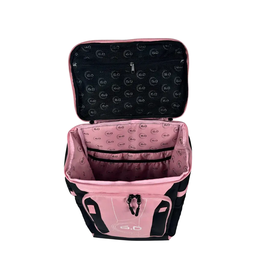 Interior view of Six Zero Performance Backpack with pink lining and compartments for organization.