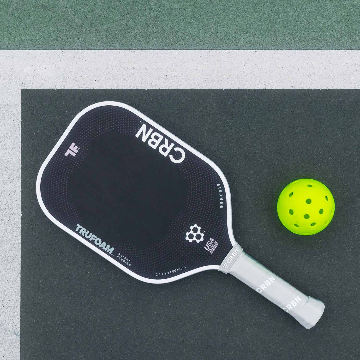 CRBN TruFoam™ Genesis Series pickleball paddle with neon yellow ball on court