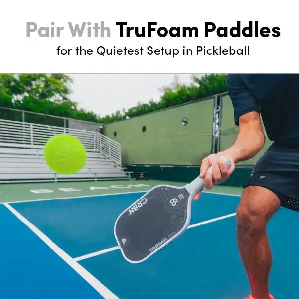 Person using CRBN Quiet Pickleballs with TruFoam paddles on a pickleball court for silent practice.