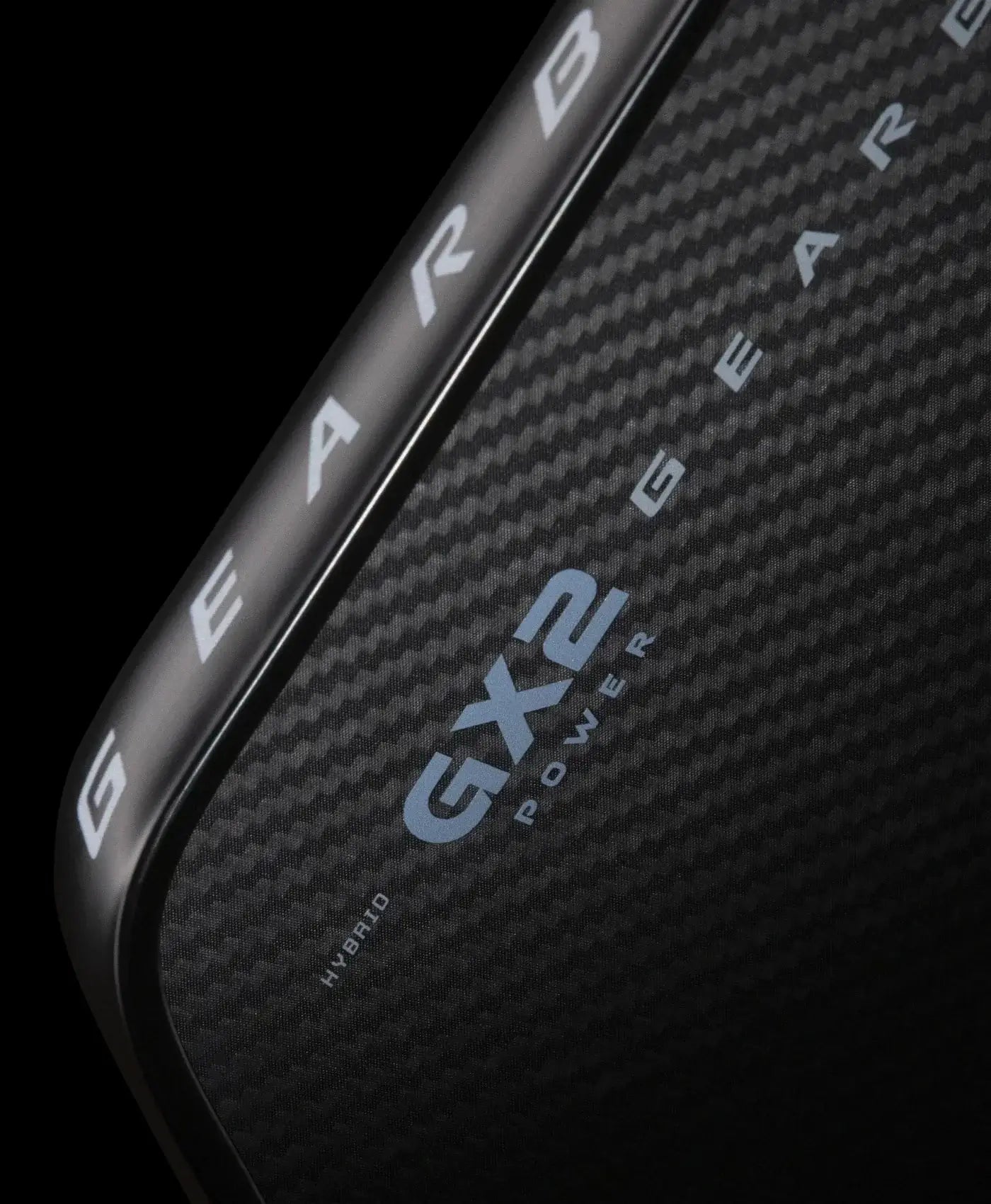 Close-up of Gearbox GX2 Power Hybrid paddle showcasing carbon fiber texture and logo.