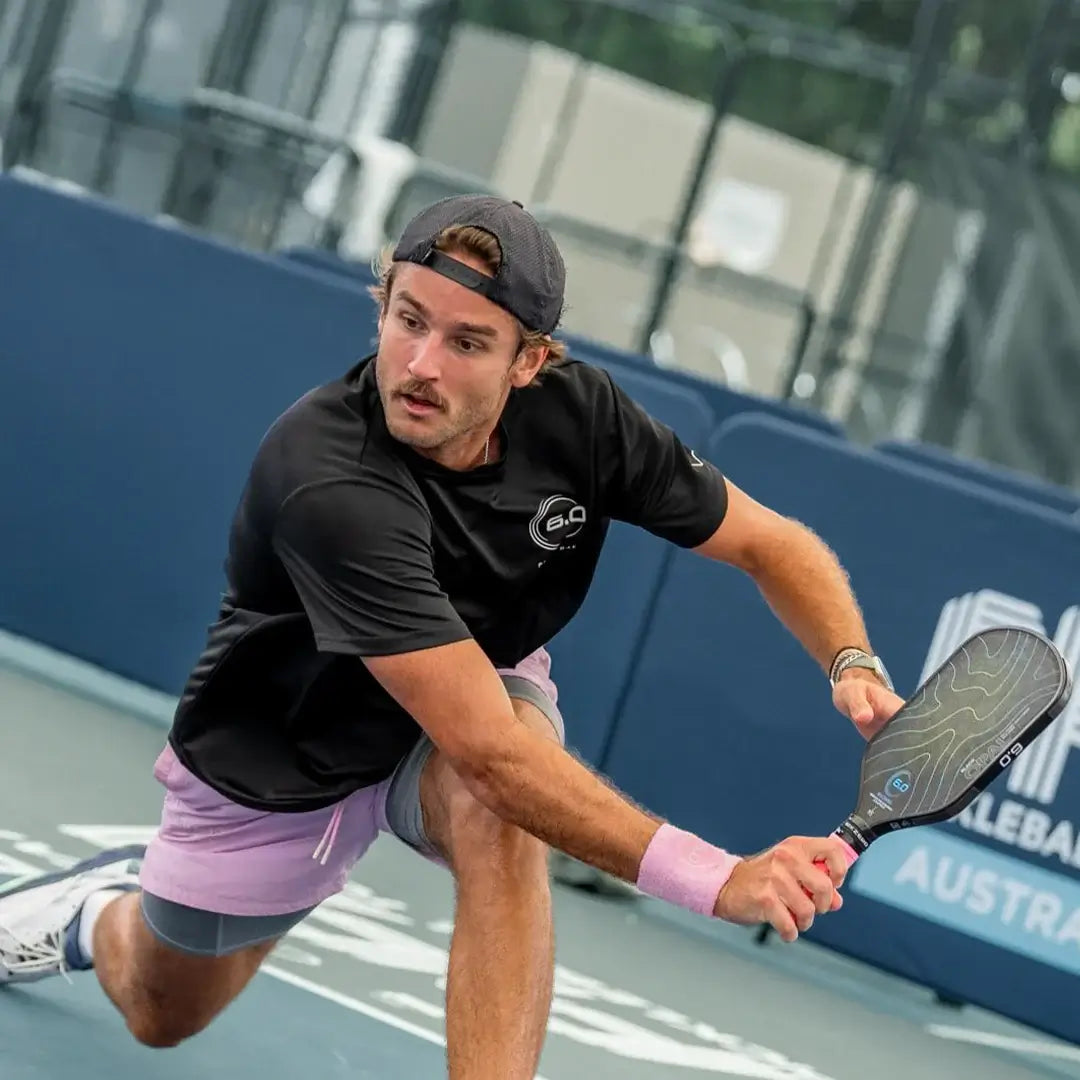 Player using Siz Zero Black Opal paddle during a match, showcasing precision and control on the court.