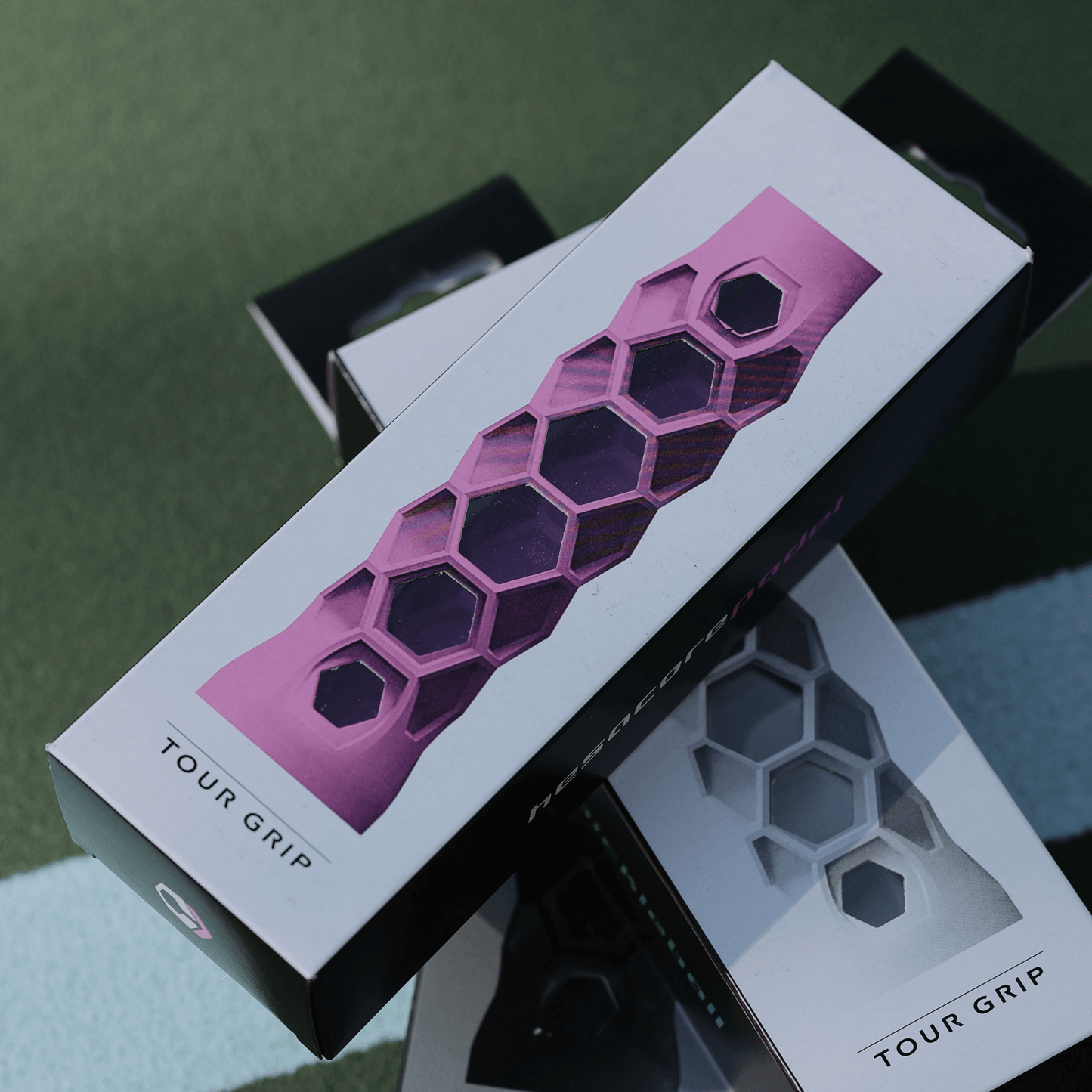 Hesacore XS Pink Pickleball Grip in packaging showcasing honeycomb design for ergonomic fit and sweat absorption.