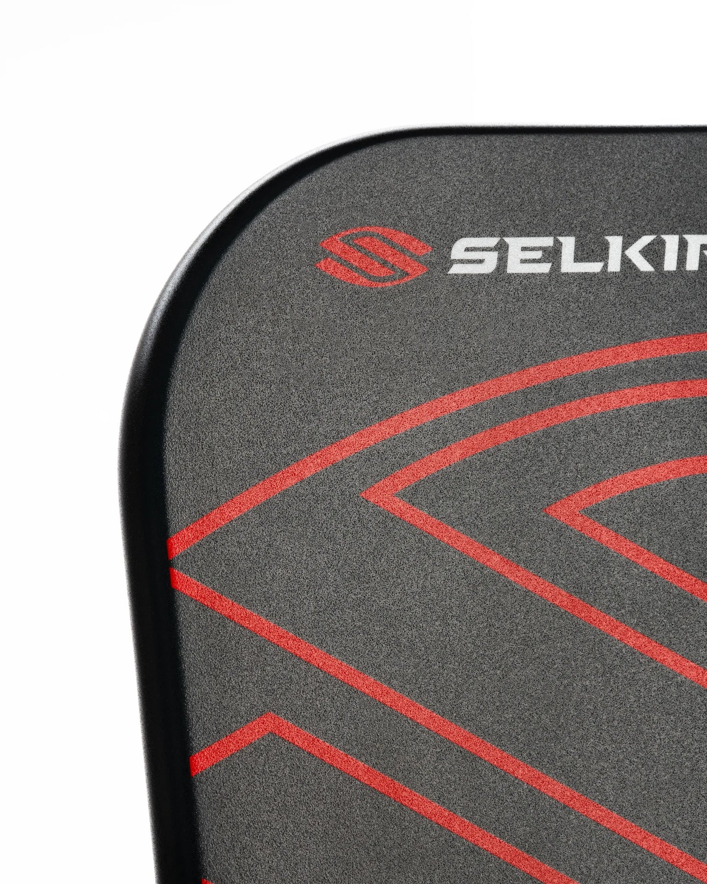 Close-up of the Selkirk AMPED Pro Air pickleball paddle with sleek black and red design.