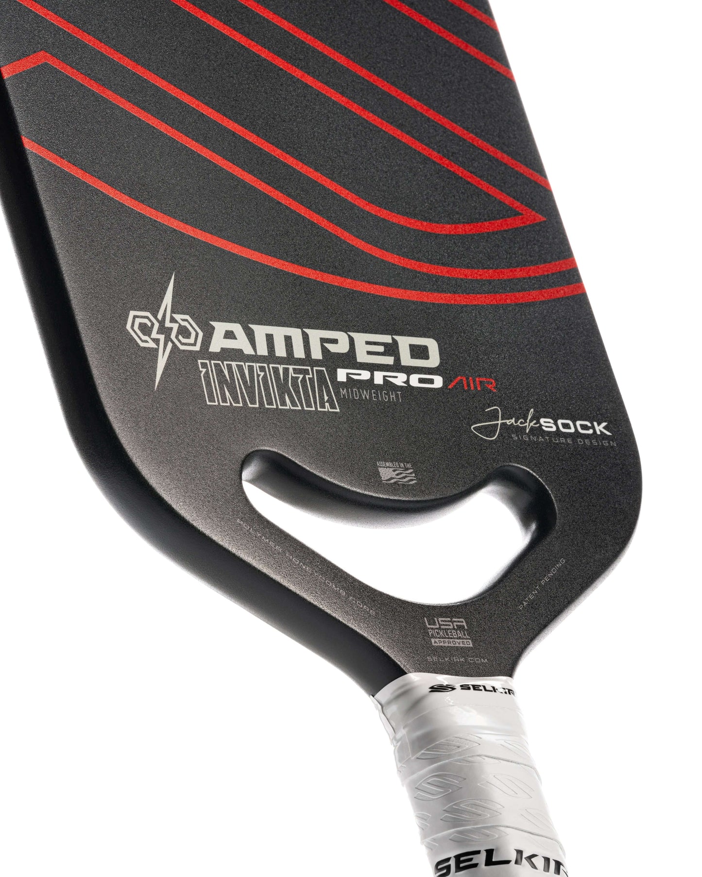 Close-up of Selkirk AMPED Pro Air Invikta pickleball paddle, showcasing its sleek design and lightweight handle.