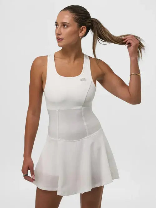 Woman in a white Selkirk Sport Pro Line Pickleball Dress showcasing athletic style and comfort.