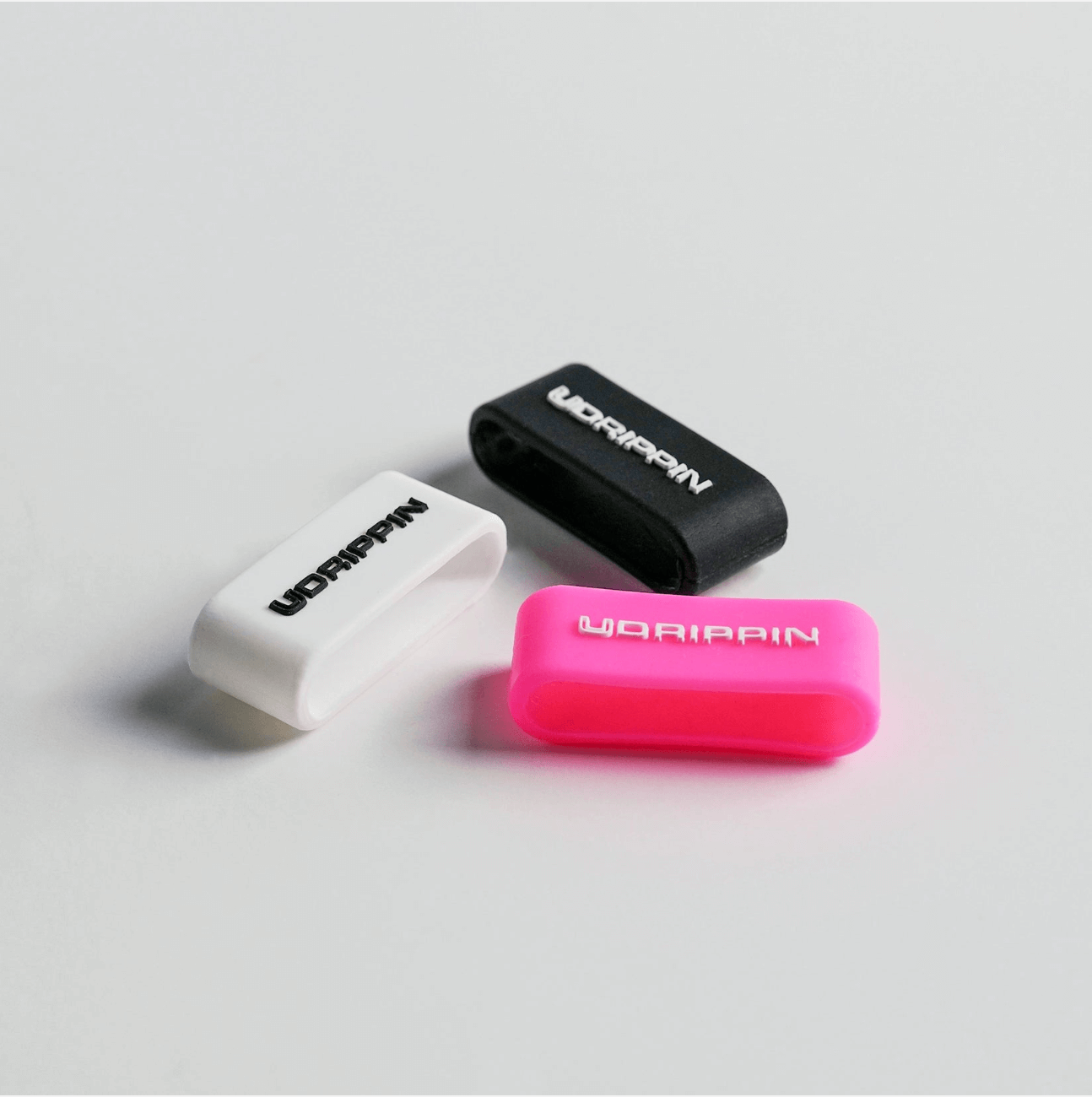 UDRIPPIN Paddle Silicone Rings in black, white, and pink, designed for added grip on paddles for all brands.