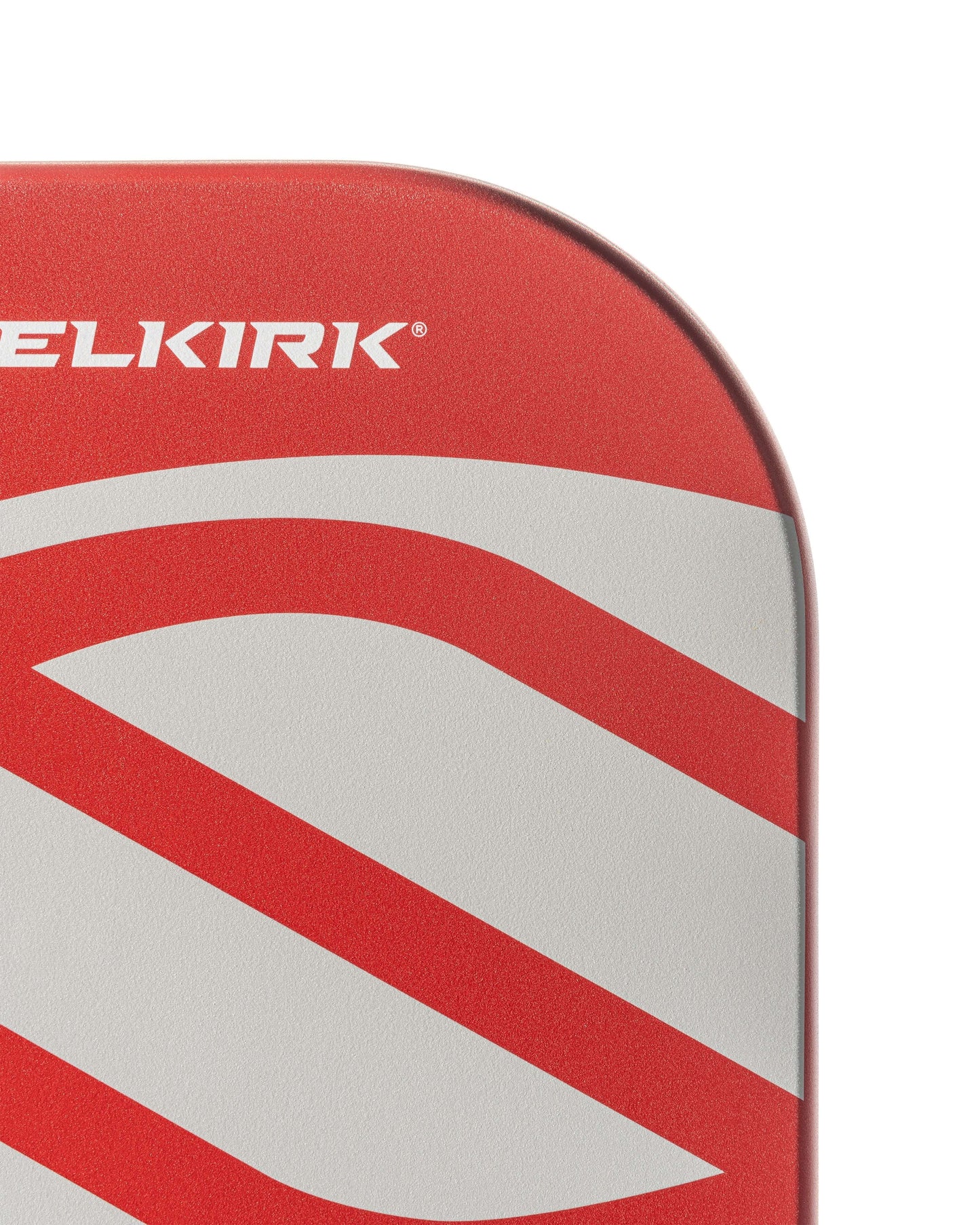 Close-up of Selkirk AMPED Pro Air pickleball paddle showcasing vibrant red design and logo.