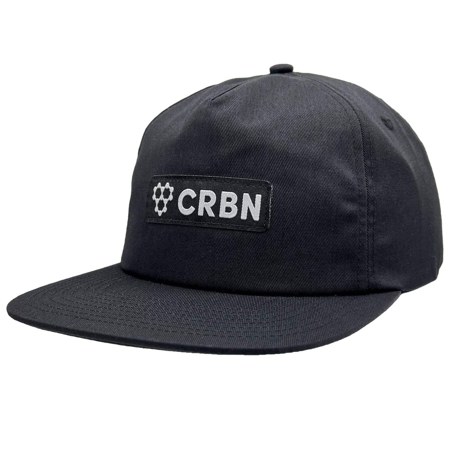 CRBN Essential Snapback Hat in black, featuring a woven patch and adjustable snapback closure.