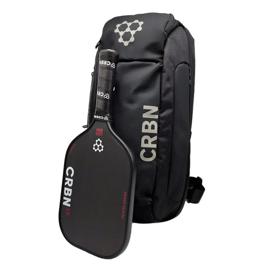 CRBN Pro Team Sling Bag with pickleball paddle, ideal for athletes and outdoor adventures in a sleek, durable design.