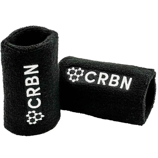 CRBN wristband set in black, featuring embroidered design, soft terry loop material, ideal for sports or style.
