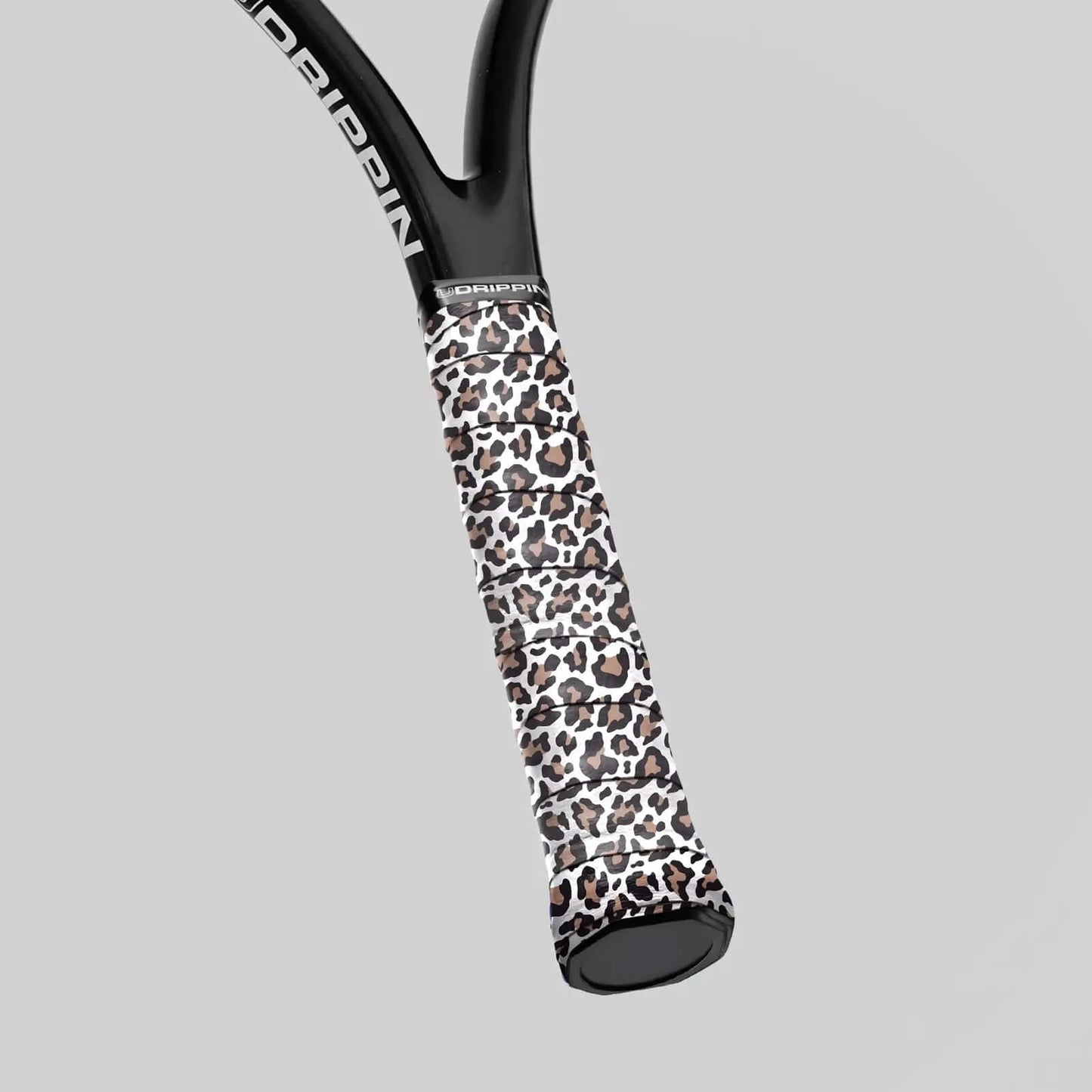 Udrippin White Leopard Print - Custom Grips showcased on a racquet handle with a stylish leopard pattern.