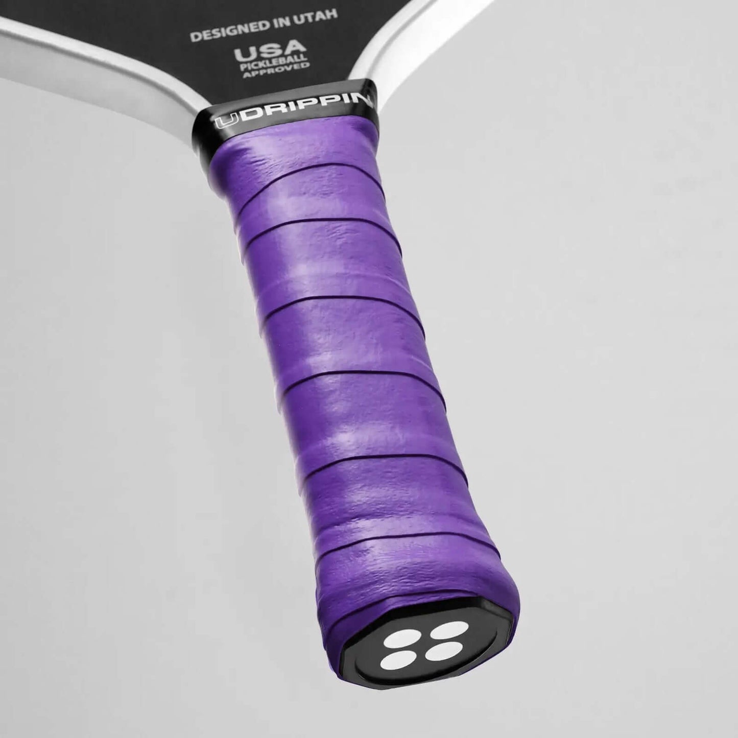 Udrippin Purple Magic - Pro Tour purple grip on a pickleball paddle, showcasing high quality tack and sweat absorbent features.