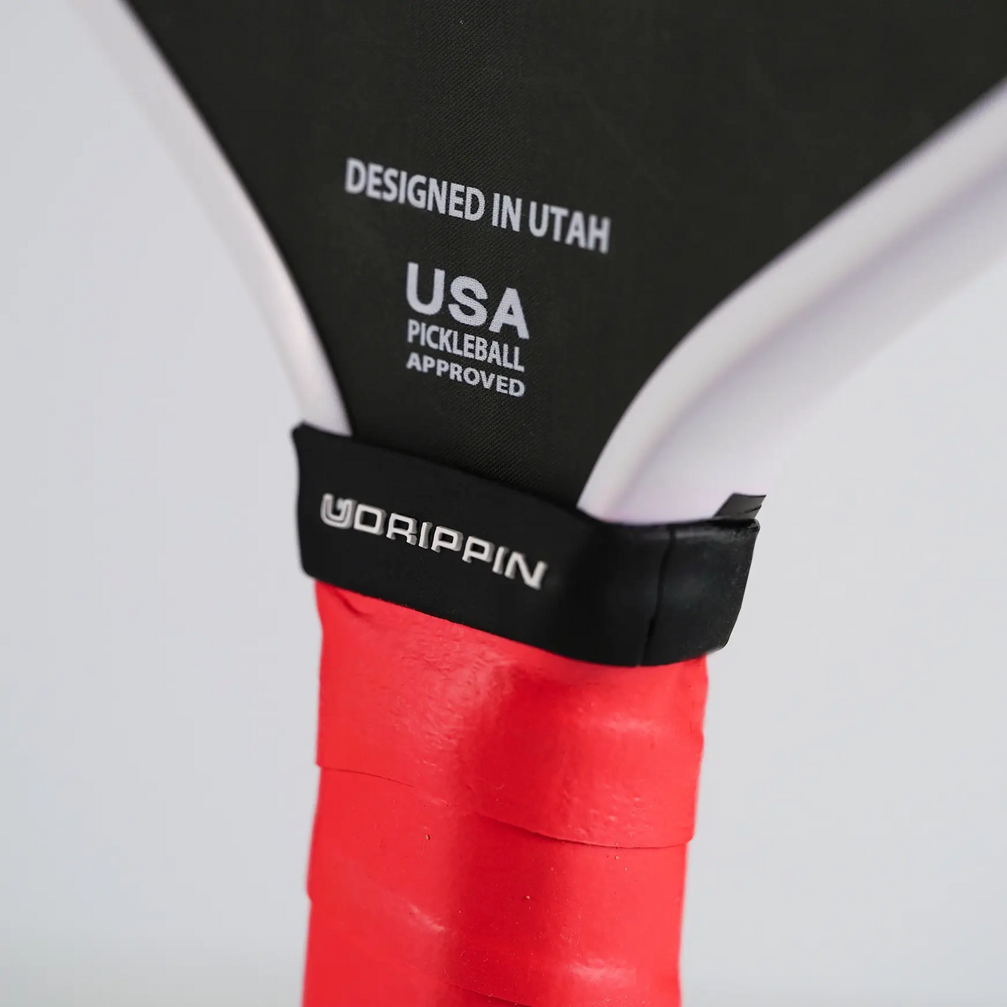 UDRIPPIN Paddle Silicone Ring on a pickleball paddle, designed in Utah, USA. Enhance grip with this high-quality silicone ring.