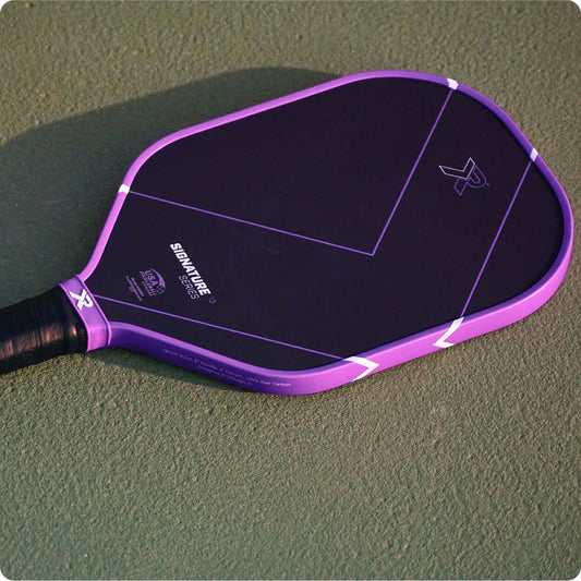 Premium pickleball paddle resting on an outdoor court, illustrating the 2026 shift toward foam-core paddles