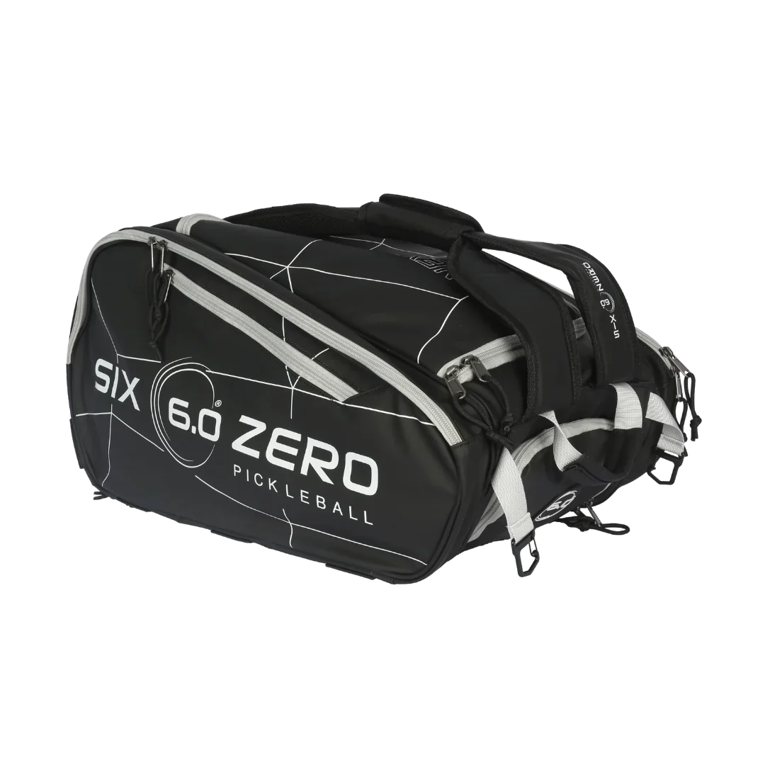 Black pickleball bag with multiple compartments and Six 6.0 Zero branding for sports enthusiasts.