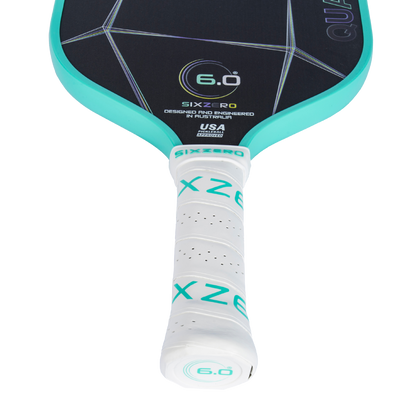 Six Zero Quartz Pickleball Paddle with teal edges and white handle, designed for quality performance at an affordable price