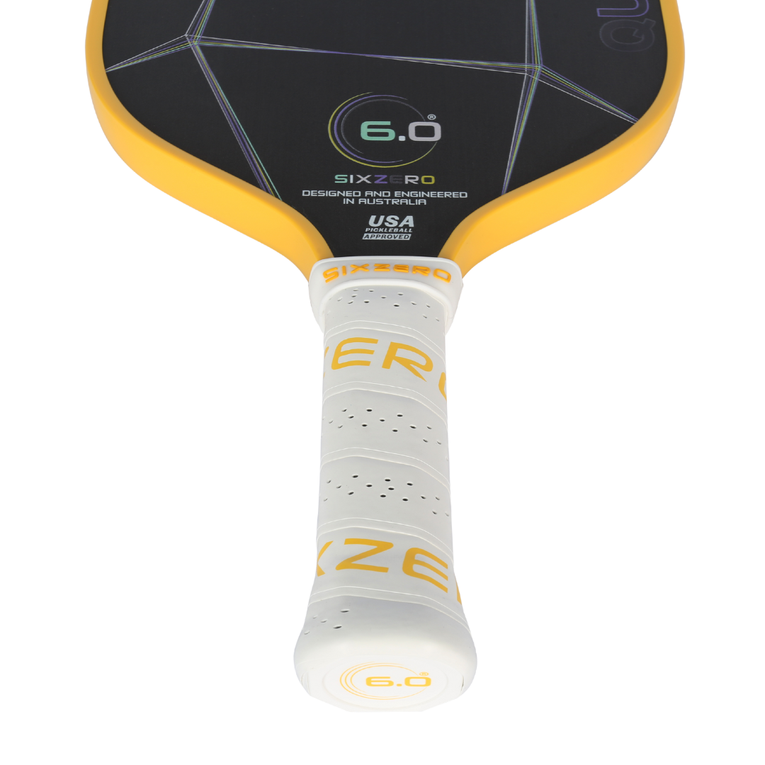 Six Zero Quartz Pickleball Paddle with yellow accents and cushioned handle, designed for quality performance and affordability