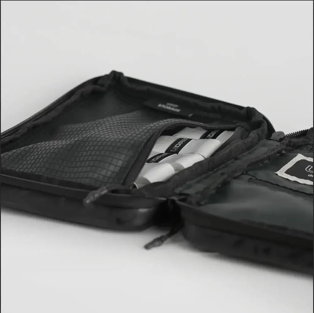UDRIPPIN Grip Case open with organized contents in black PU leather design.