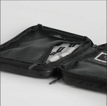 UDRIPPIN Grip Case open with organized contents in black PU leather design.
