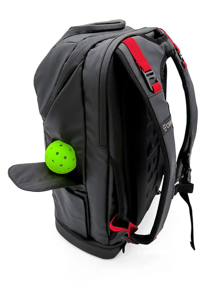 CRBN Pro Team Backpack 2.0 side view with ball garage and green pickleball.