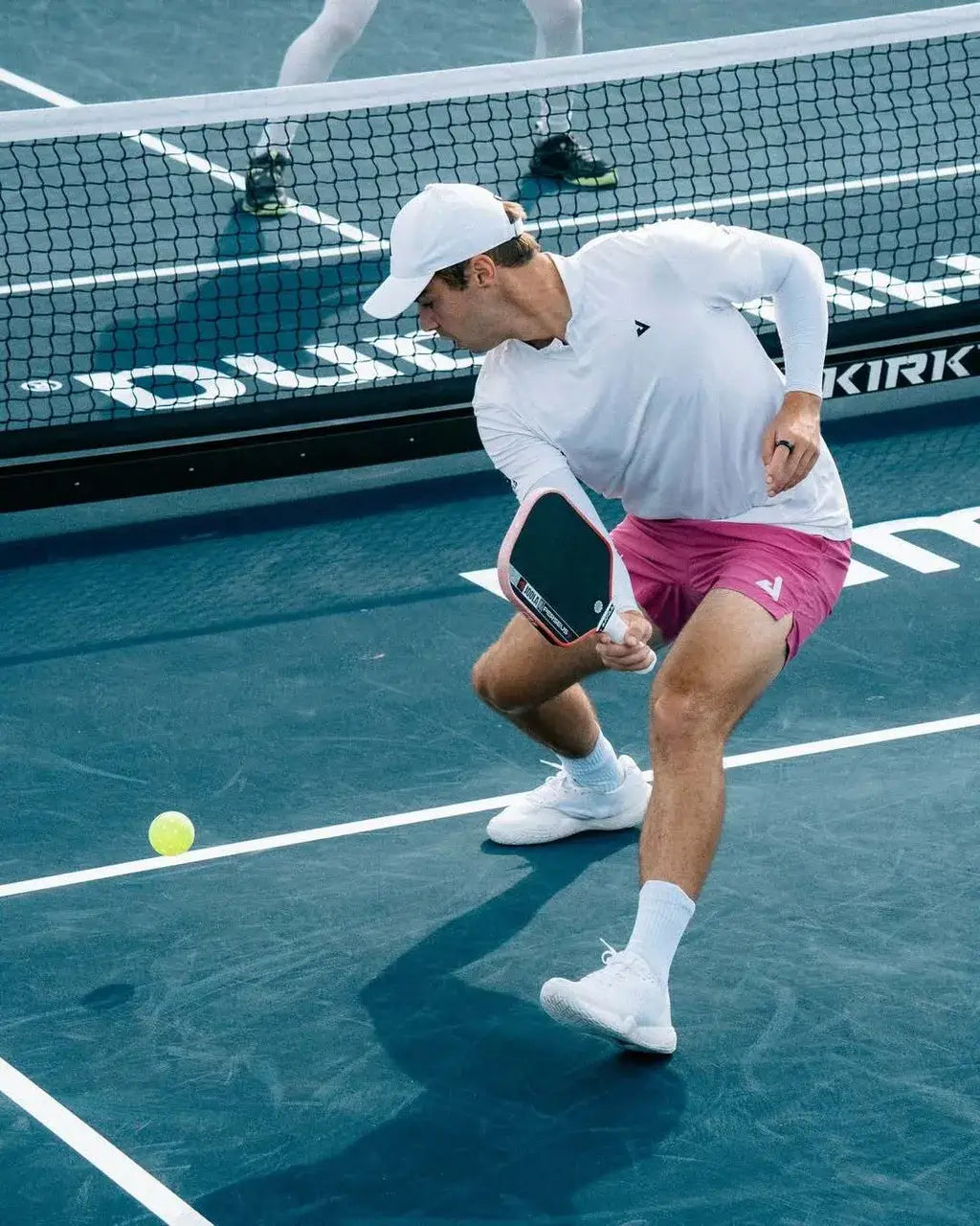 Player using the Joola Perseus Pro V Ben Johns Blaze Red (Global) paddle during a tennis match.