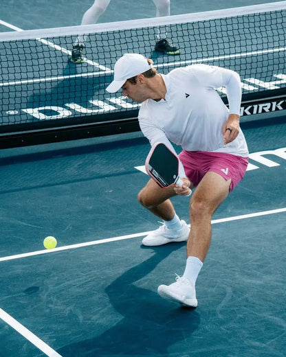 Player using the Joola Perseus Pro V Ben Johns Blaze Red (Global) paddle during a tennis match.