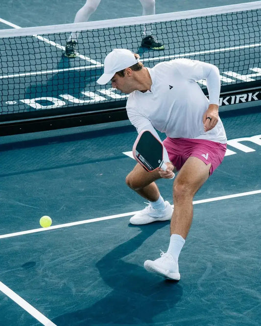 Player using the Joola Perseus Pro V Ben Johns Blaze Red (Global) paddle during a tennis match.