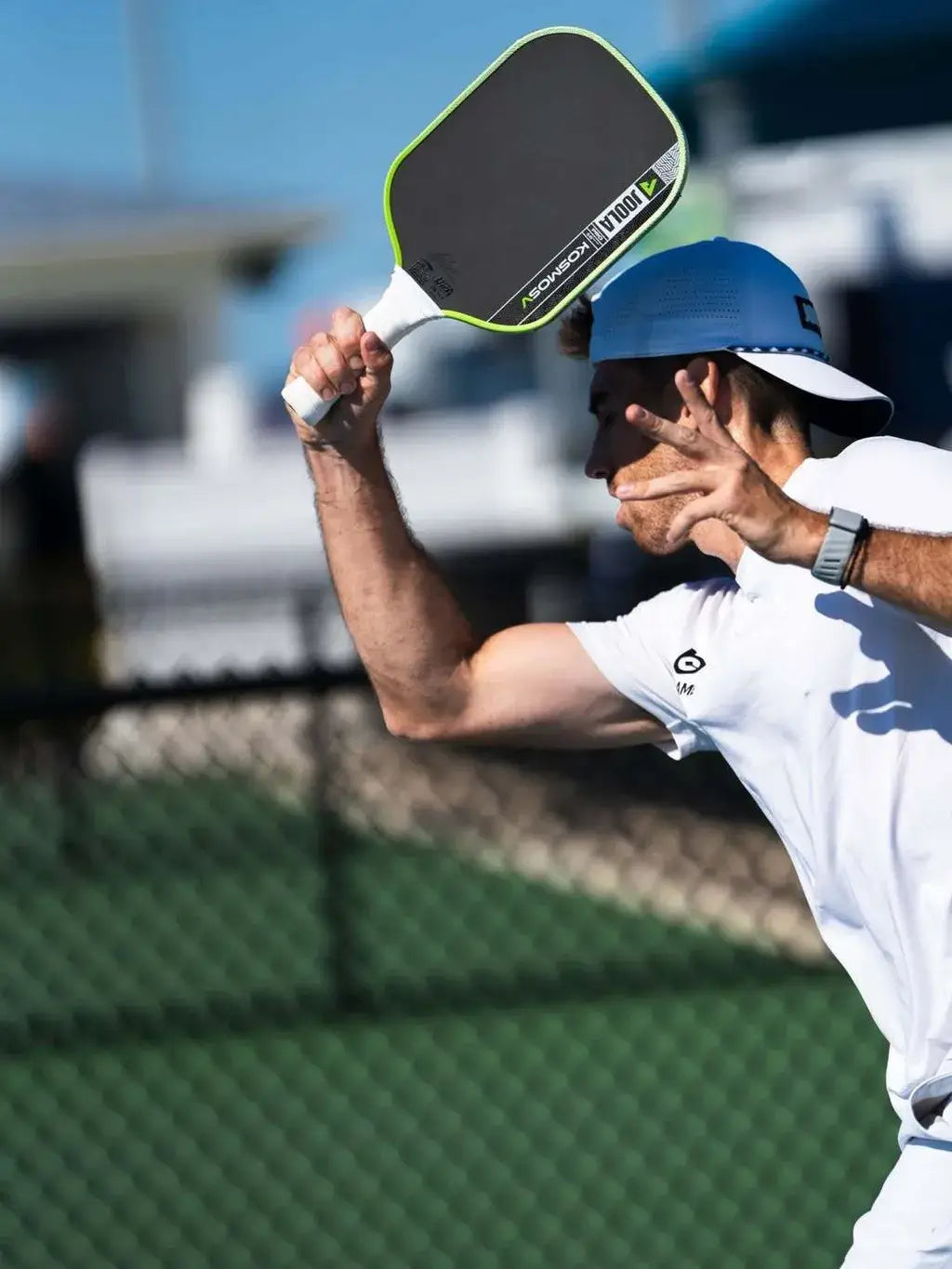 Joola Kosmos Pro V Surge Green (Global) paddle in action during a sports match on the court.