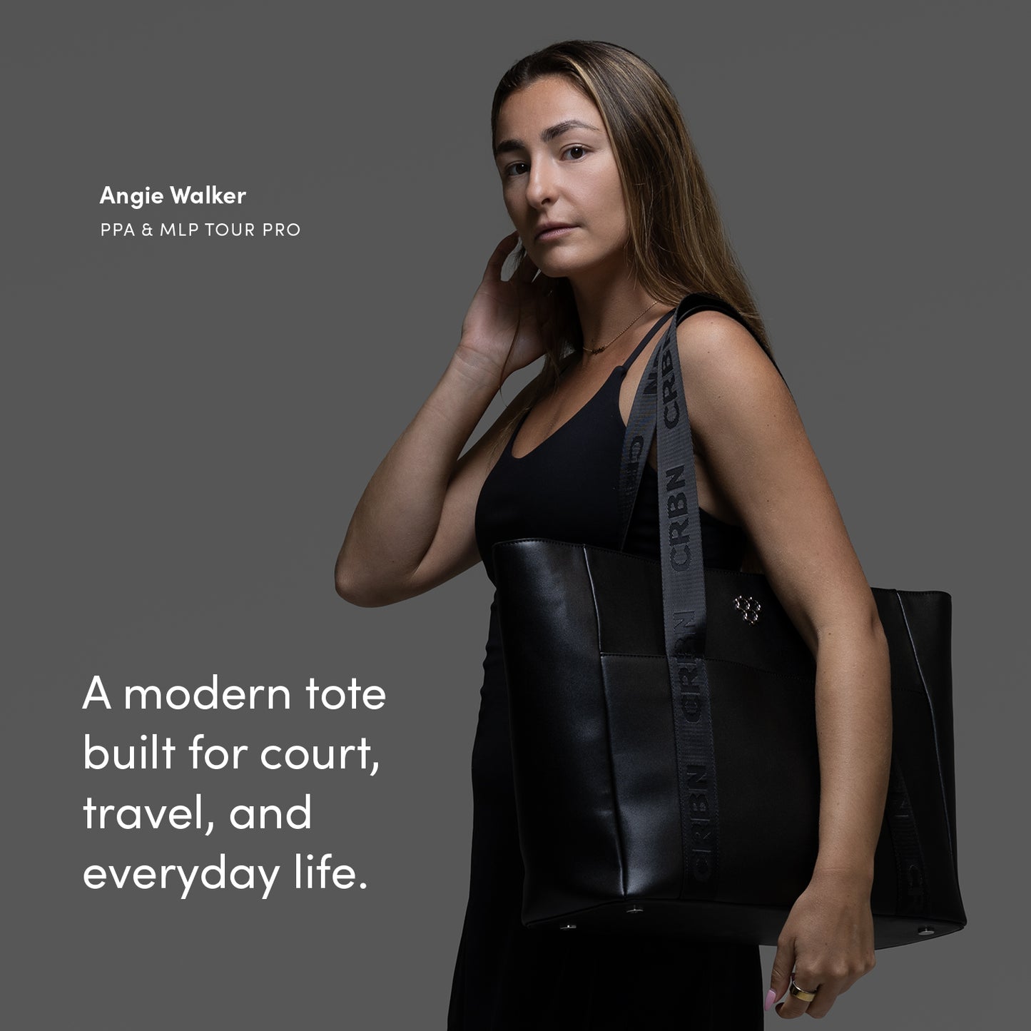 CRBN Club Pickleball Tote Bag [NEW] showcased by a player, emphasizing style and versatility for court and travel.