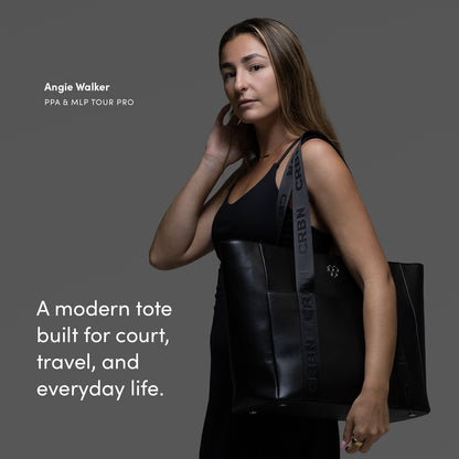 CRBN Club Pickleball Tote Bag [NEW] showcased by a player, emphasizing style and versatility for court and travel.