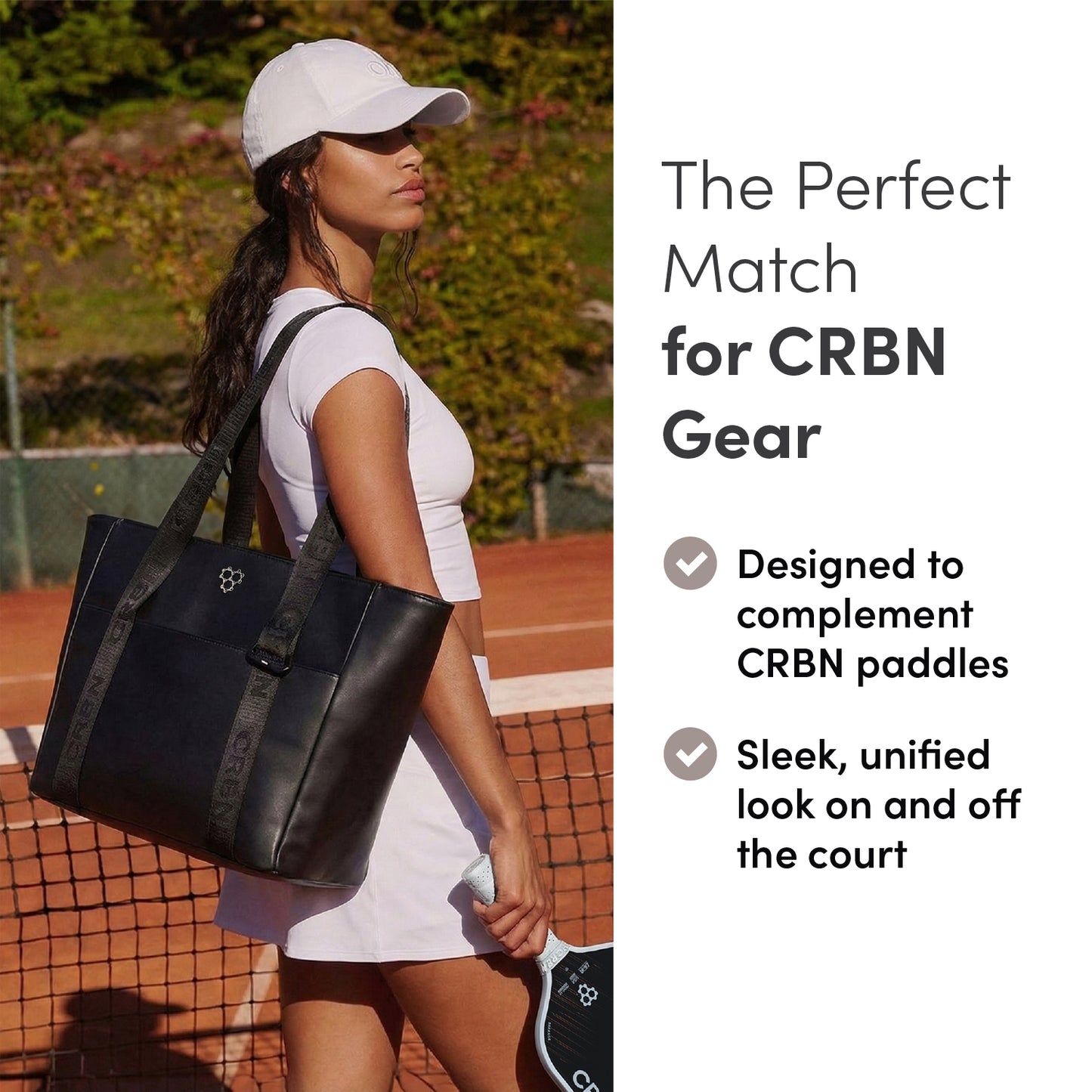 Woman holding the CRBN Club Pickleball Tote Bag [NEW] on a court, showcasing its stylish design and utility.