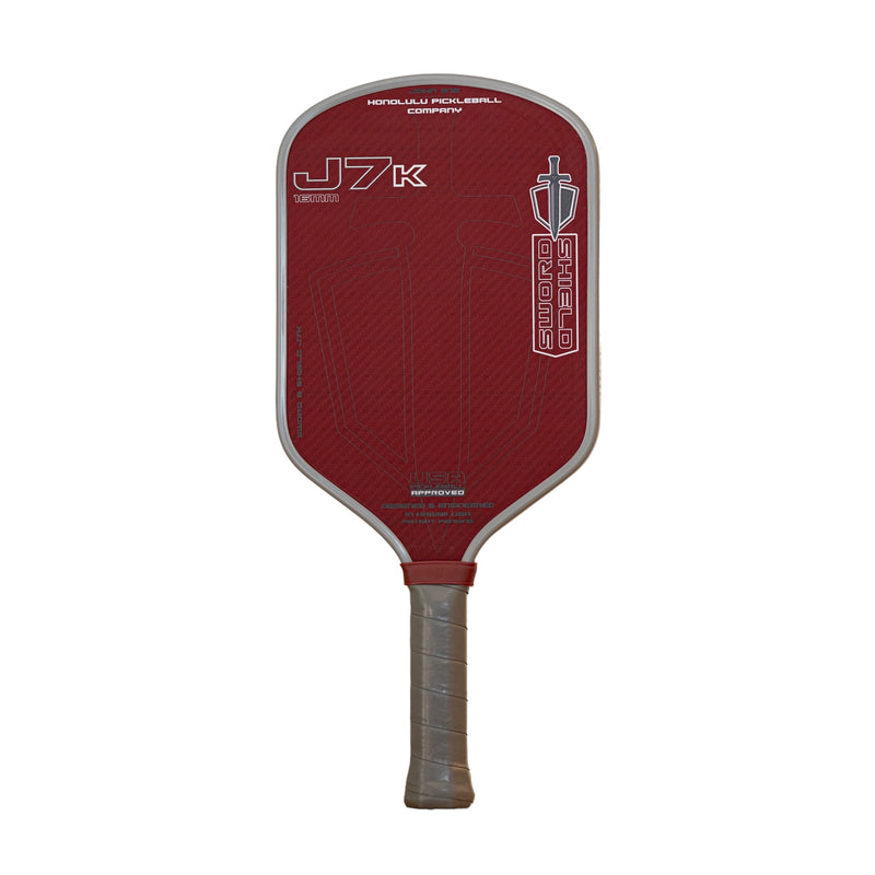 Honolulu Sword & Shield J7K Pickleball Paddle with red design, showcasing power, spin, and control with elongated aero shape.