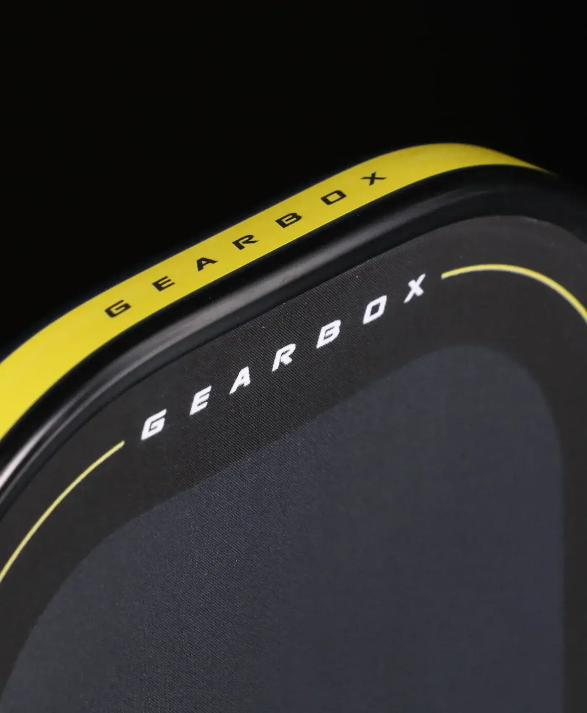 Close-up of the Gearbox Pressure X 8E Elongated paddle showcasing its sleek design and branding.