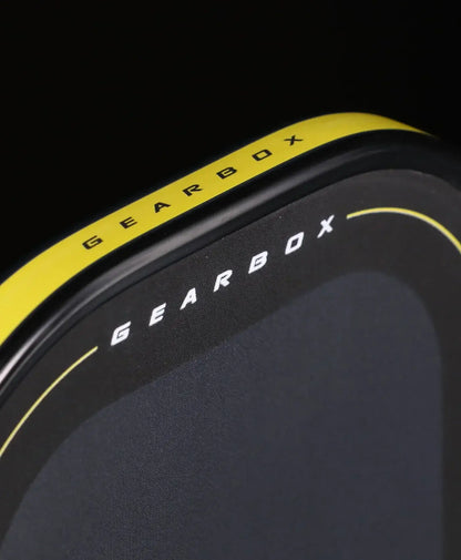 Close-up of the Gearbox Pressure X 8E Elongated paddle showcasing its sleek design and branding.