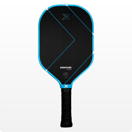 ProXR Signature Series pickleball paddle with T700 Ultra-Raw Carbon, extended 6-inch handle, optimized balance, and thermoformed edge guard.