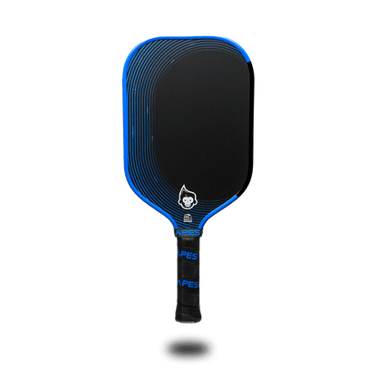 Pickleball Apes Harmony X paddle with blue accents, featuring a honeycomb poly core and premium leather grip.