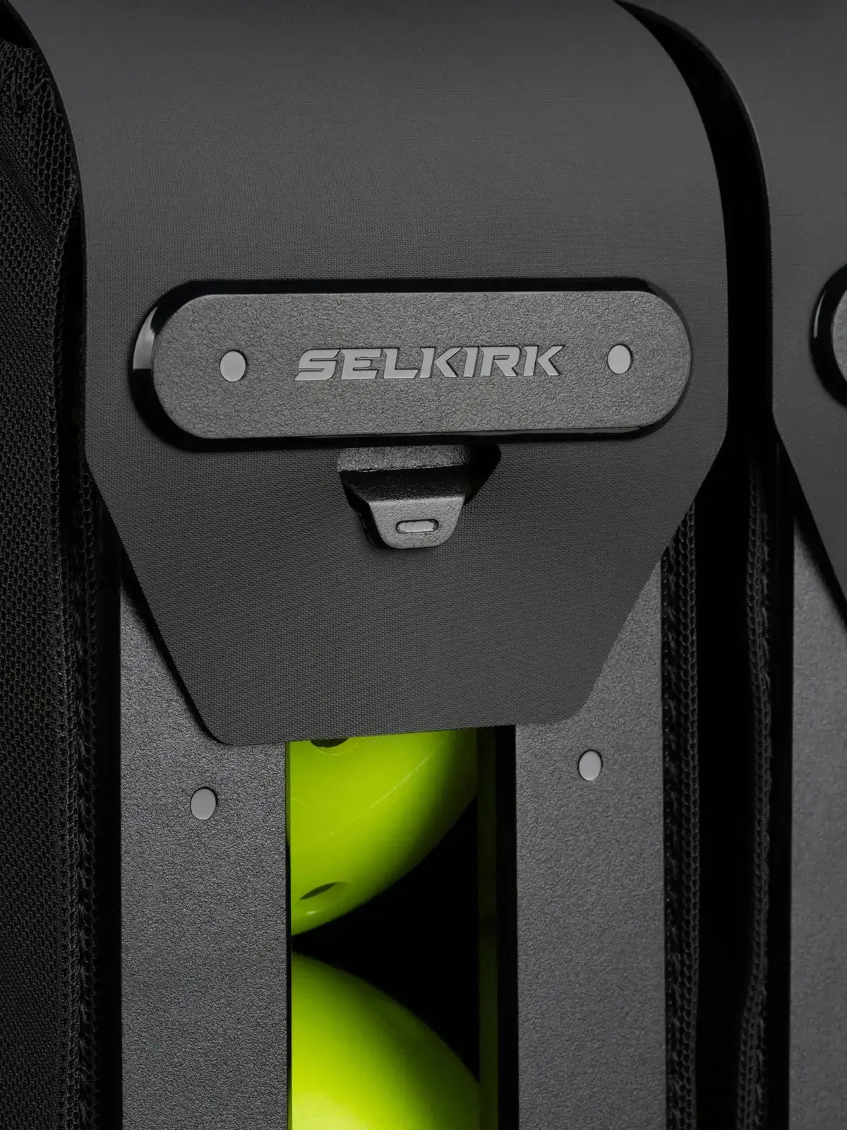 Close-up of the Selkirk Pro Line 2.0 Tour Pickleball Backpack (35L) with pickleballs and secure closure.