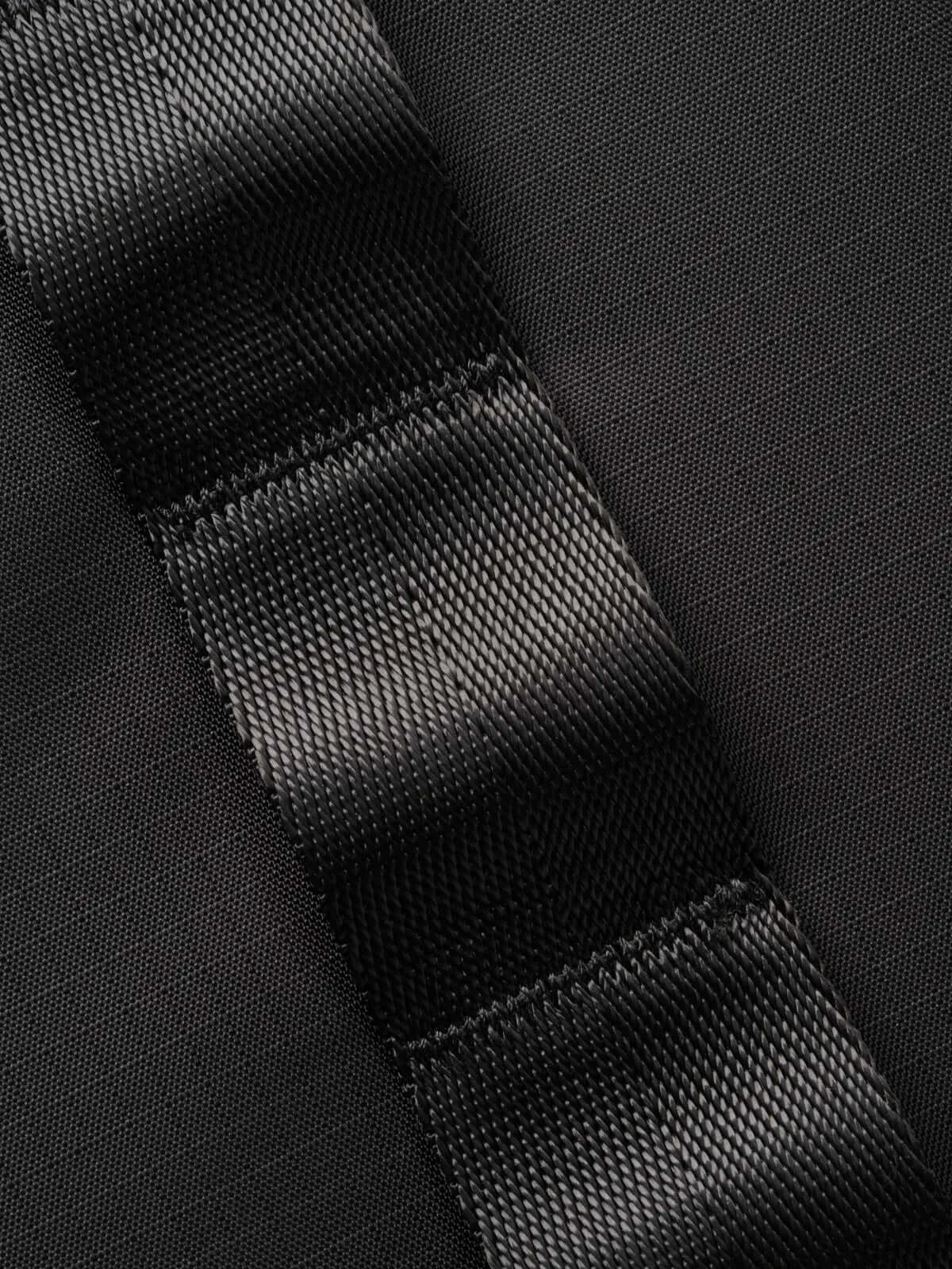 Close-up of the durable strap fabric used in the Selkirk Pro Line 2.0 Pickleball Duffle (45L) highlighting texture and quality.