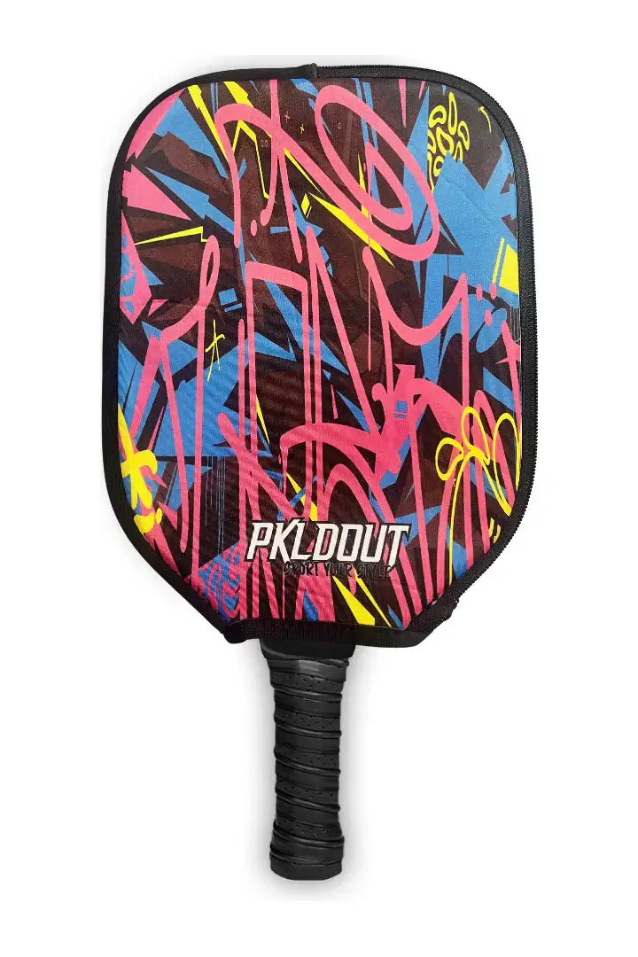 PKLDOUT Paddle Cover featuring vibrant graffiti-style design for ultimate protection and style on the court.