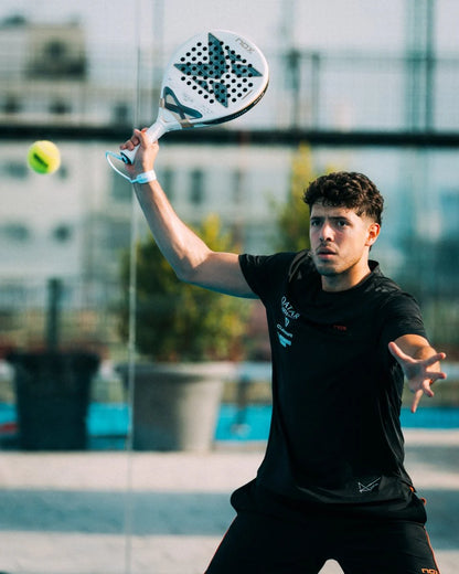 Player showcasing skills with the NOX AT10 LUXURY GENIUS 12K ALUM XTREM 2026 BY AGUSTÍN TAPIA paddle tennis racket.