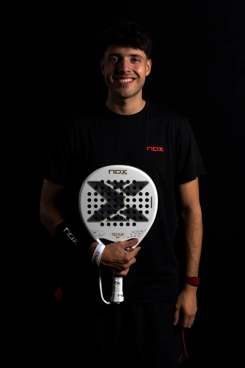 NOX AT10 LUXURY GENIUS 12K ALUM XTREM 2026 BY AGUSTÍN TAPIA athlete holding paddle racket