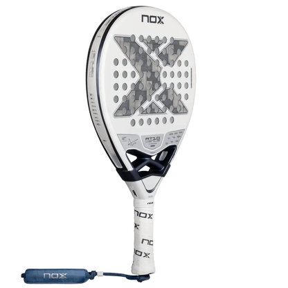 NOX AT10 LUXURY GENIUS 12K ALUM XTREM LITE 2026 BY AGUSTÍN TAPIA paddle racket with white and gray design.