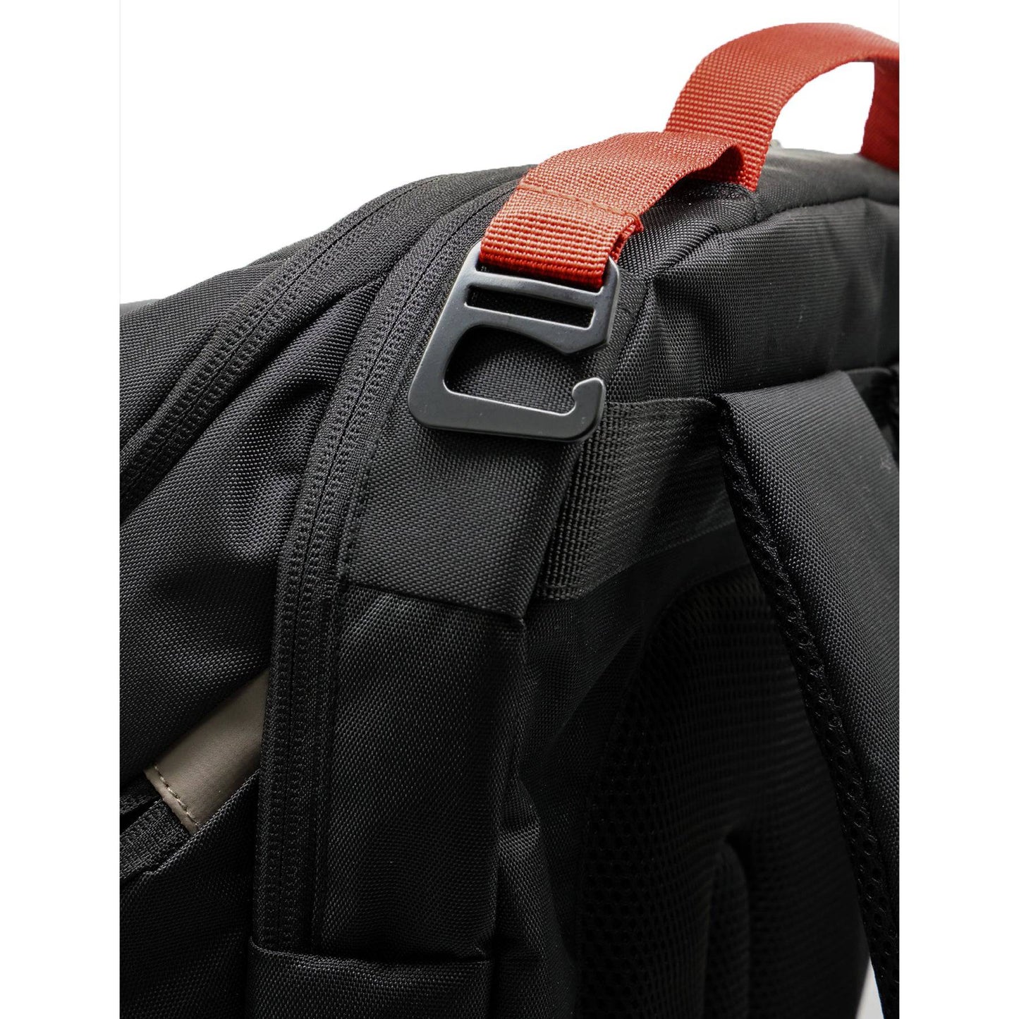 Close-up of CRBN Pro Team Backpack showing durable fabric and adjustable orange strap for easy carrying.