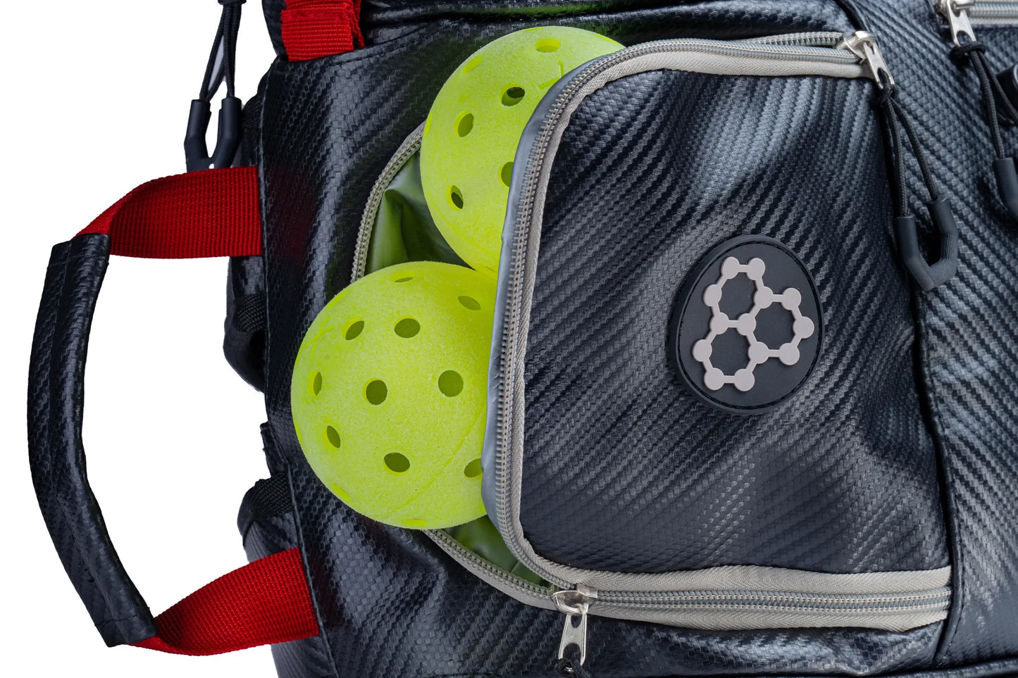 CRBN Pro Team Tour Bag 2.0 with green pickleballs in a pocket, showcasing its storage capability.