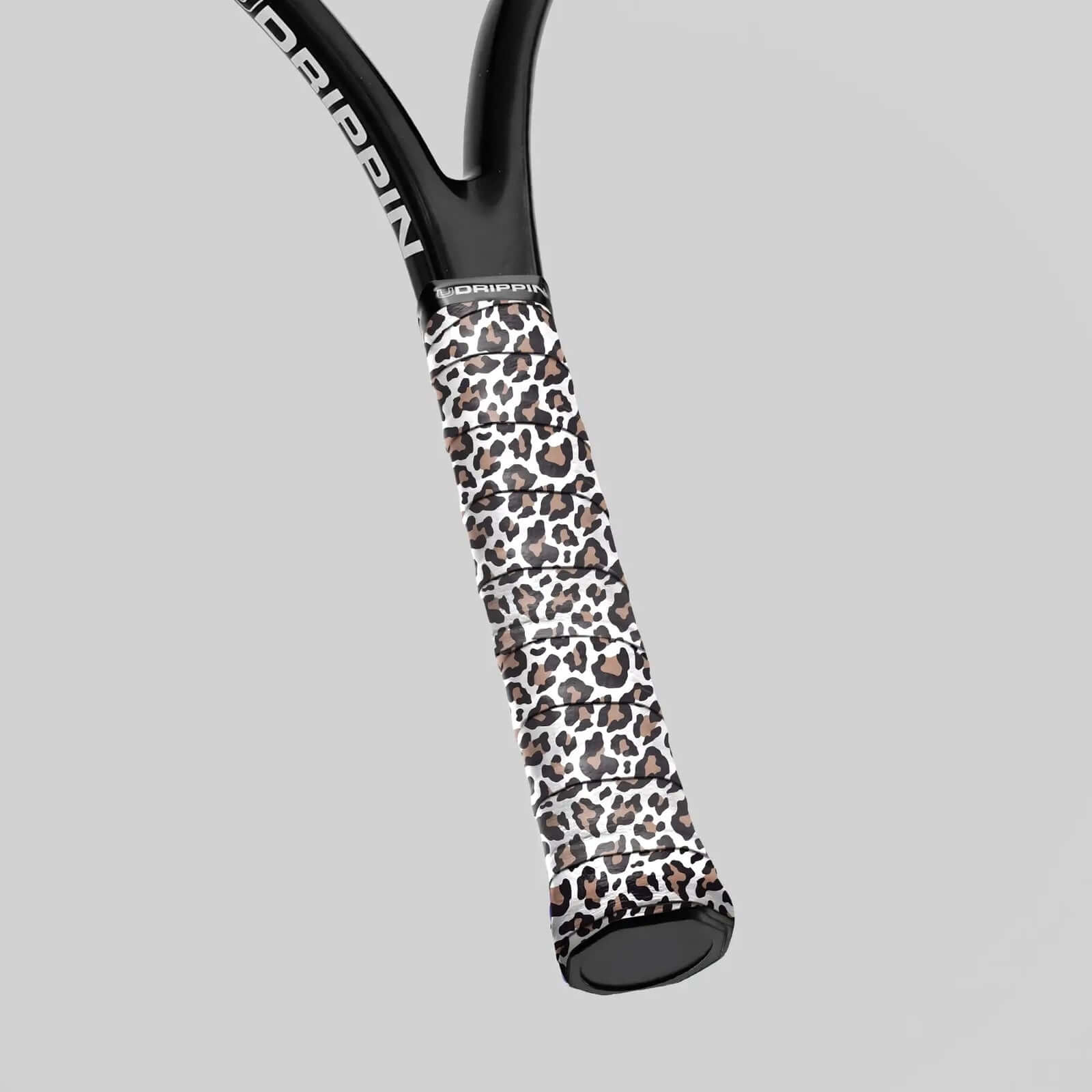 Udrippin White Leopard Print - Custom Grips showcased on a racquet handle with a stylish leopard pattern.
