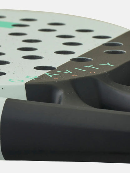 HEAD Gravity Pro Padel Racquet close-up showing perforated surface and grip details.