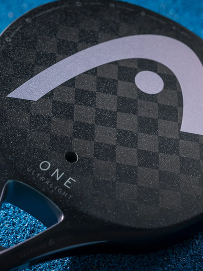 HEAD One Ultralight Padel Racquet close-up view showing logo and textured surface.